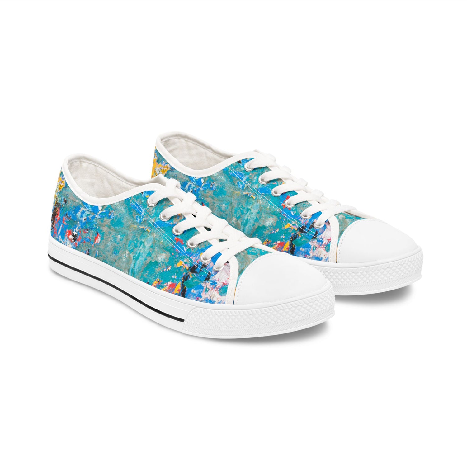 Pair of womens sneakers with a colorful abstract design on a white background