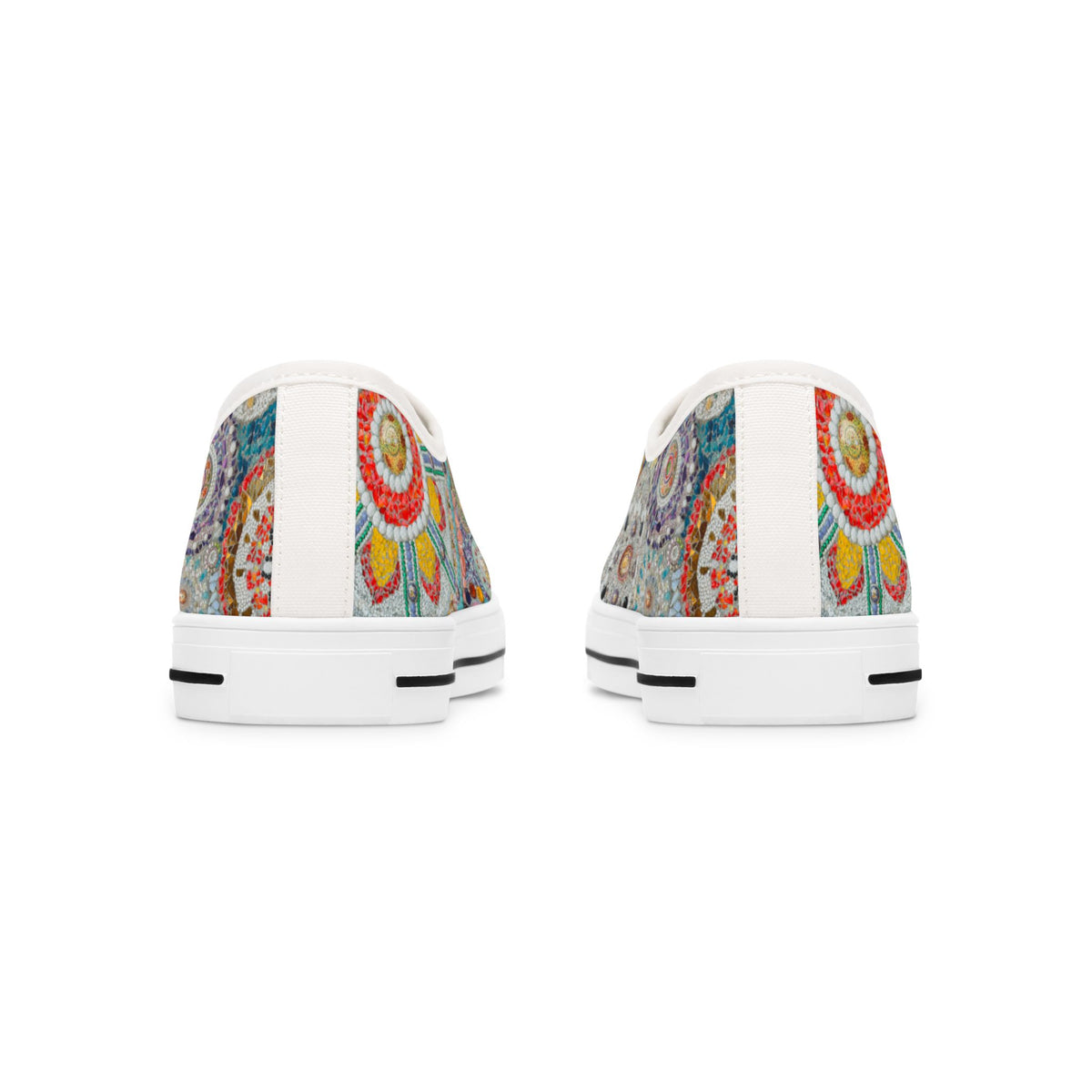 Pair of womens white sneakers with colorful abstract patterns on a white background