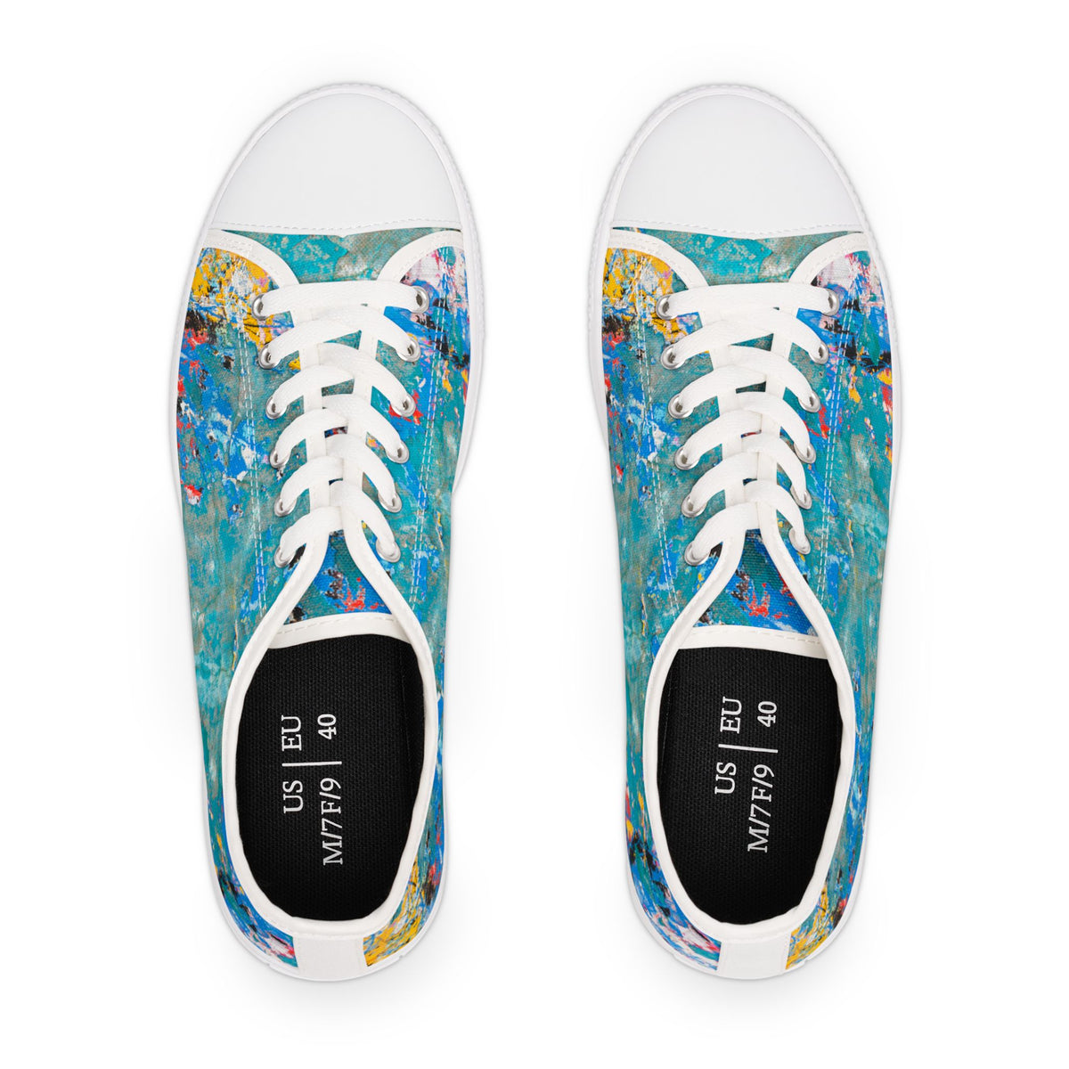 Pair of womens sneakers with colorful abstract design on a white background