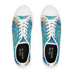 Pair of womens sneakers with colorful abstract design on a white background
