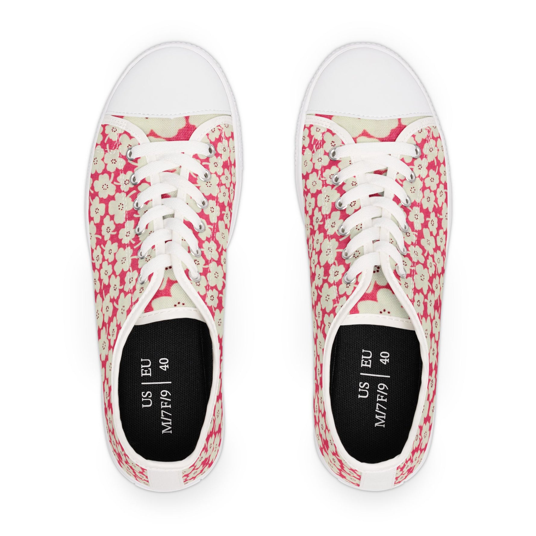 Pair of pink floral sneakers on a white background