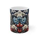 Mug with decorative design featuring berries and leaves on a white background