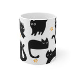 White mug with black cat pattern on a white background
