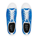 Pair of blue sneakers with white laces on a white background