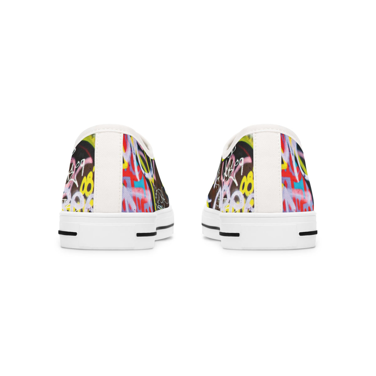 Pair of womens white sneakers with colorful graffity design on a white background