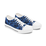 Pair of womens sneakers with blue abstract pattern on a white background
