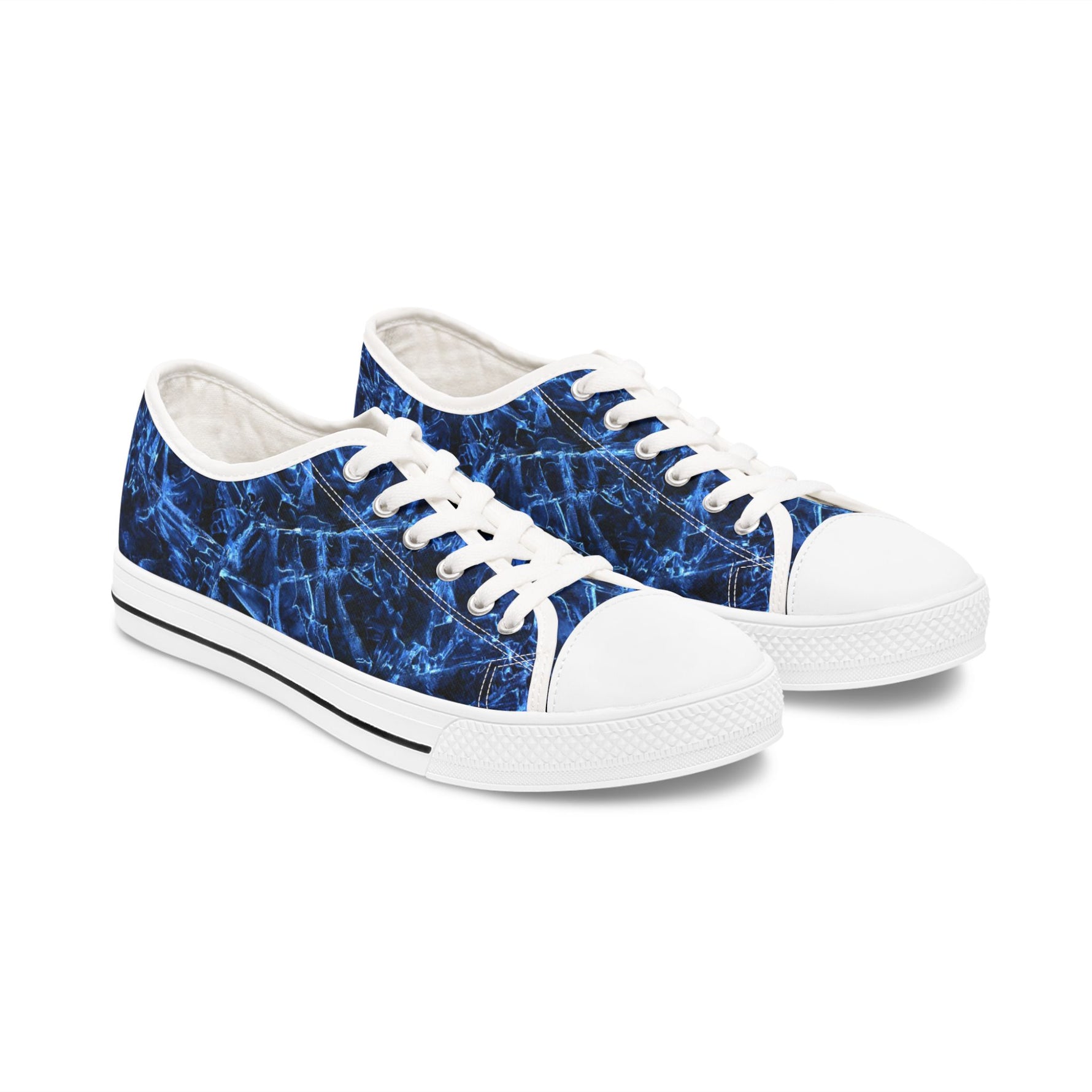 Pair of womens sneakers with blue abstract pattern on a white background