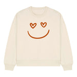 Stanley/Stella Beige sweatshirt with a smiley face design featuring heart eyes on a white background