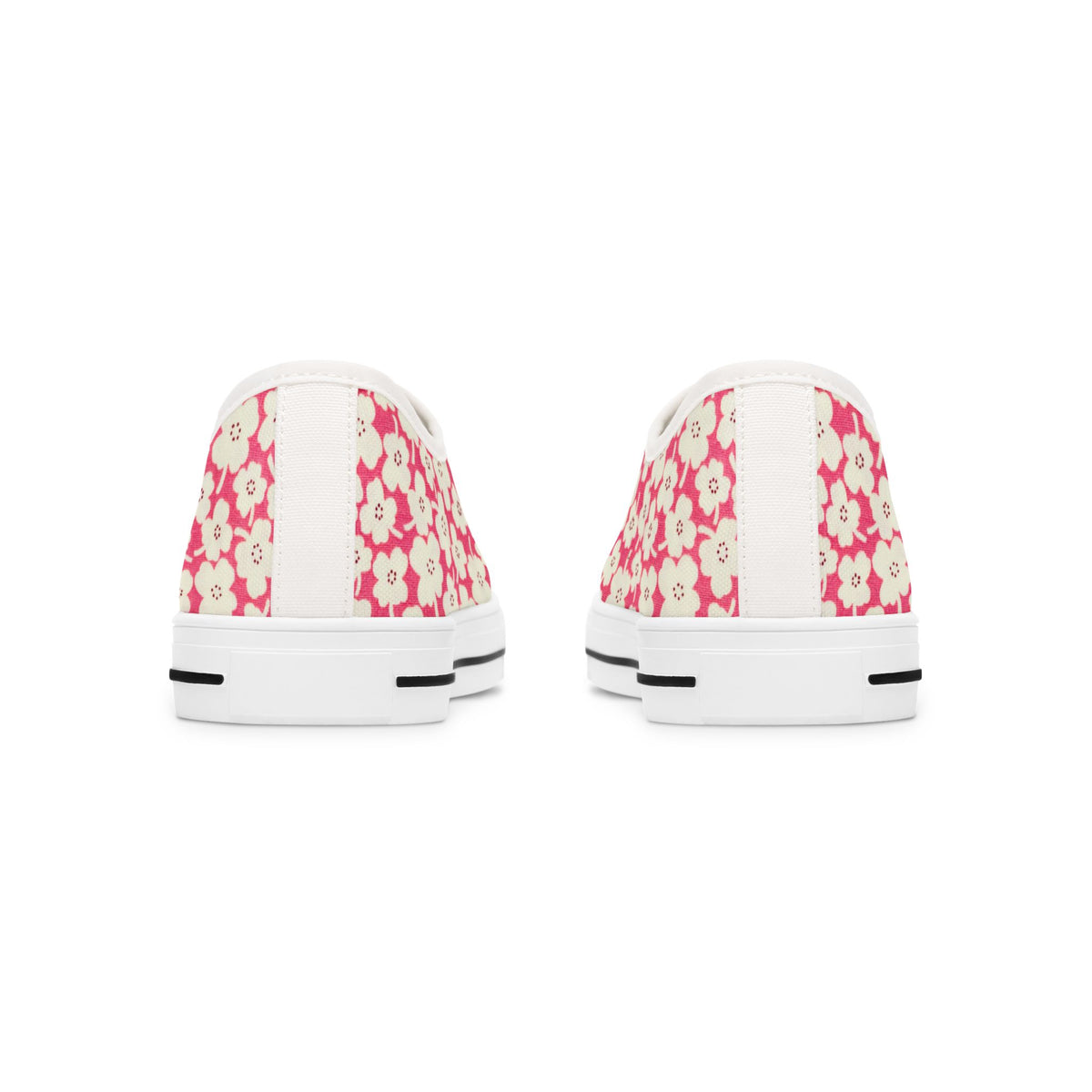 Pair of white sneakers with pink floral pattern on a white background