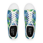 Pair of women's sneakers with a blue and green floral pattern on a white background