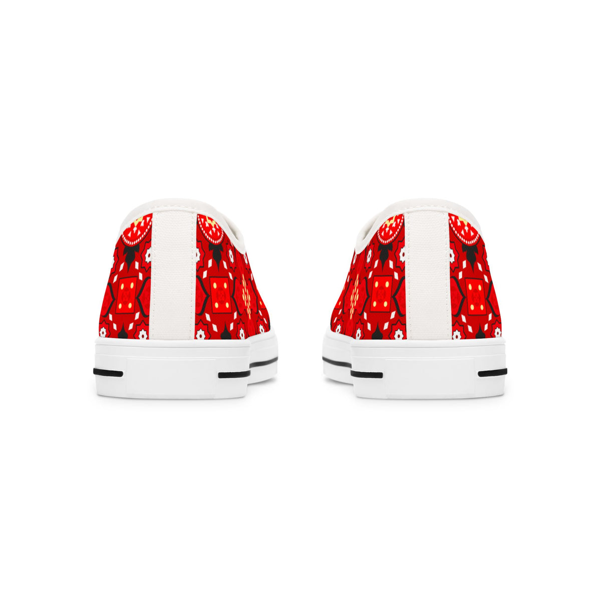 White sneakers with red strawberry pattern on a white background