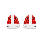 White sneakers with red strawberry pattern on a white background