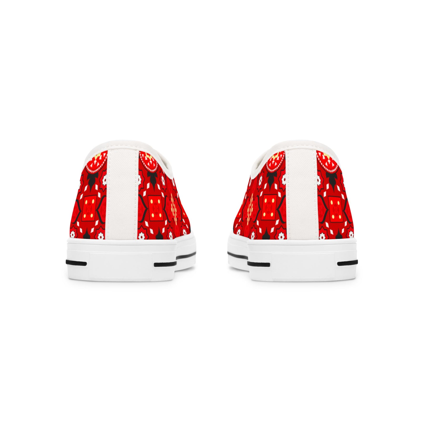 White sneakers with red strawberry pattern on a white background