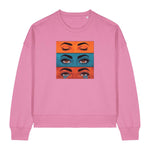 Stanley/Stella Pink sweatshirt with a graphic of eyes on a white background