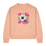 Stanley/Stella Peach-colored sweatshirt with floral design on a white background
