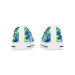 Pair of women's white sneakers with blue and green abstract pattern on a white background