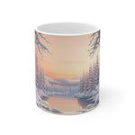 Mug with a winter landscape design featuring trees and mountains.