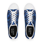Pair of blue marbled womens sneakers with white laces on a white background