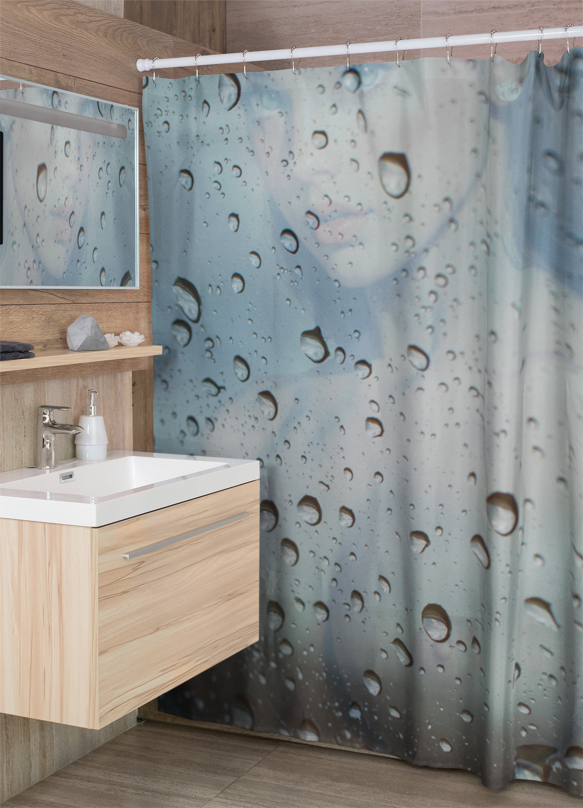 Bathroom with a shower curtain featuring water droplet design, wooden vanity, and mirror.
