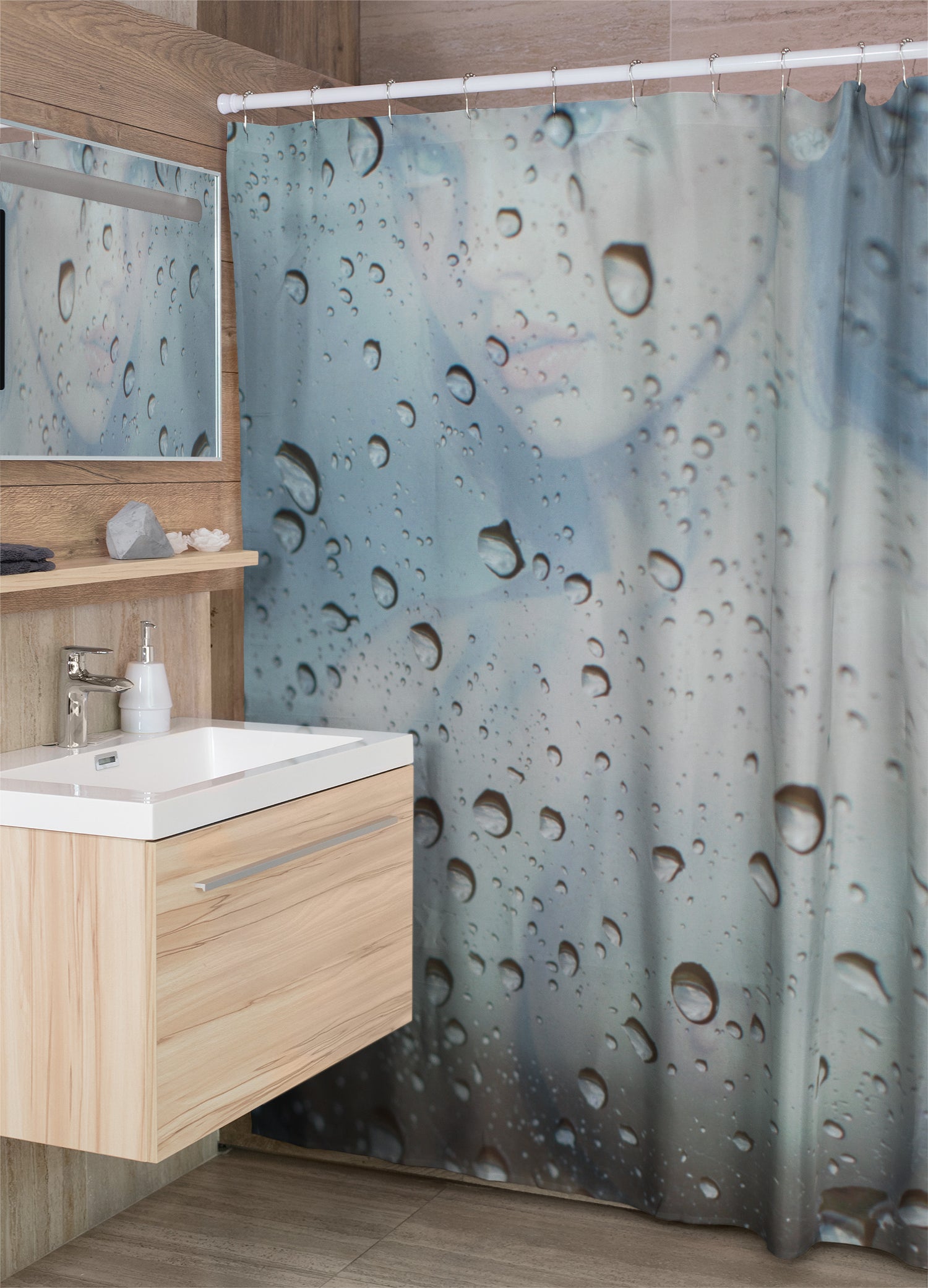 Bathroom with a shower curtain featuring water droplet design, wooden vanity, and mirror.