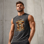 Man wearing a tank top with 'STRONG AF ZERO FUCKS GIVEN' text against a concrete wall.
