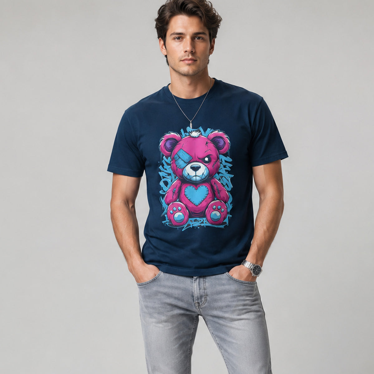 Man wearing a navy blue t-shirt with a colorful bear graphic on a gray background