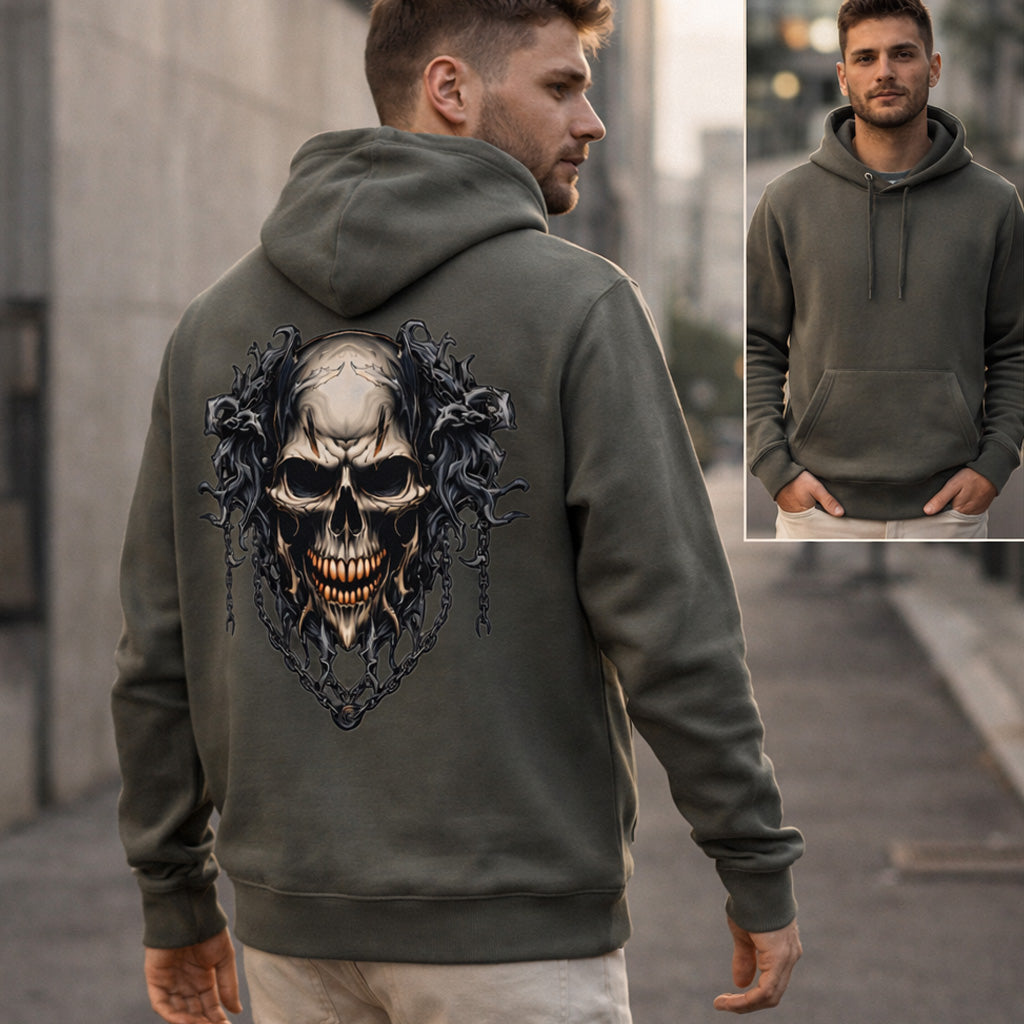 A man wearing an olive green hoodie with a large, detailed skull and gothic design on the back stands outdoors. An inset shows the front view of the hoodie, which is plain with no visible design.