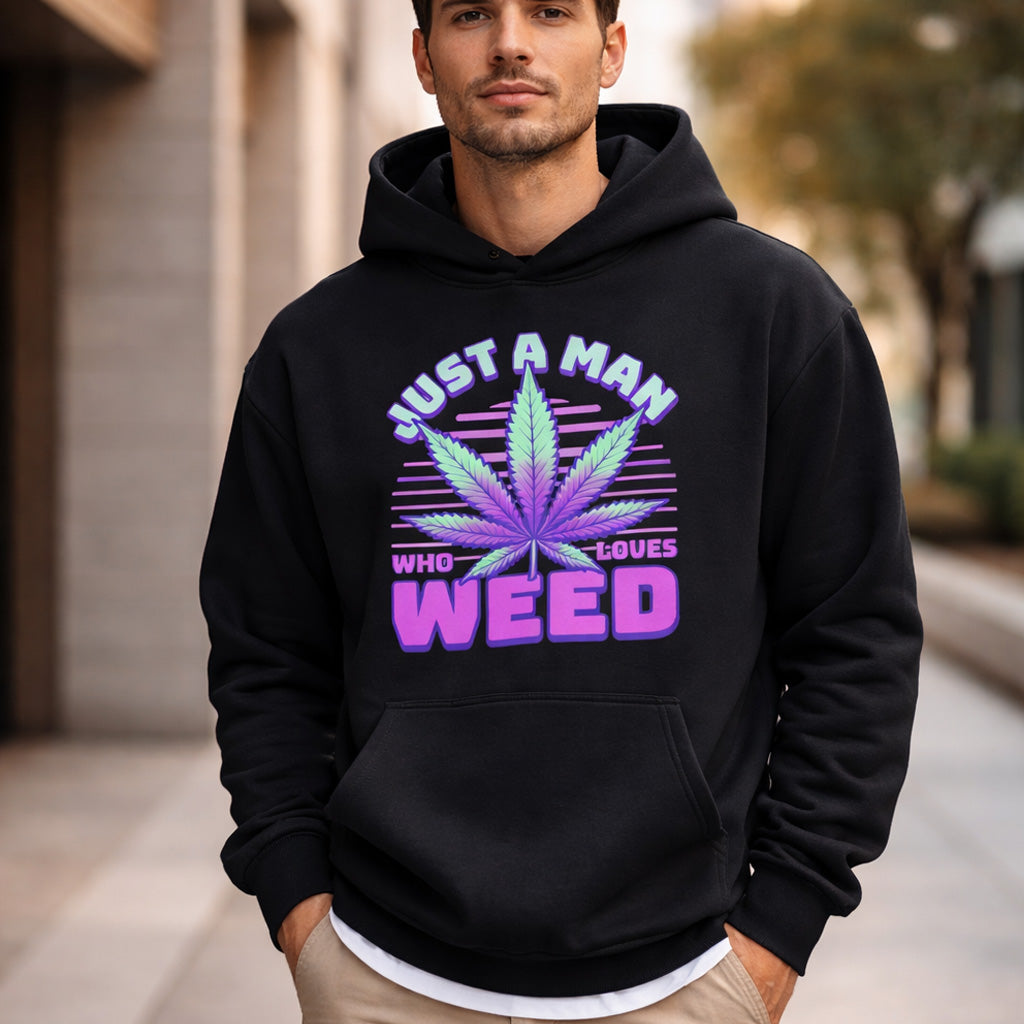 Man wearing a black hoodie with a purple cannabis leaf design and text.
