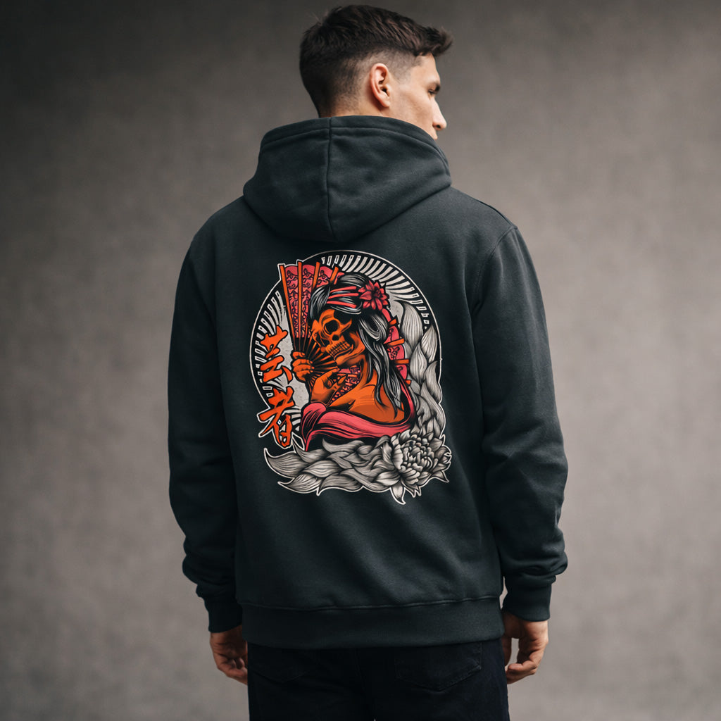 A man wearing a dark hoodie with a vibrant, detailed Japanese-style illustration on the back, featuring a woman with fans, floral elements, and bold red and orange tones.