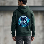 Men's  wearing a green hoodie with a wolf design on the back against a concrete wall.