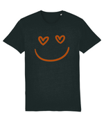 Women's Black t-shirt with a smiley face design featuring heart eyes on a white background