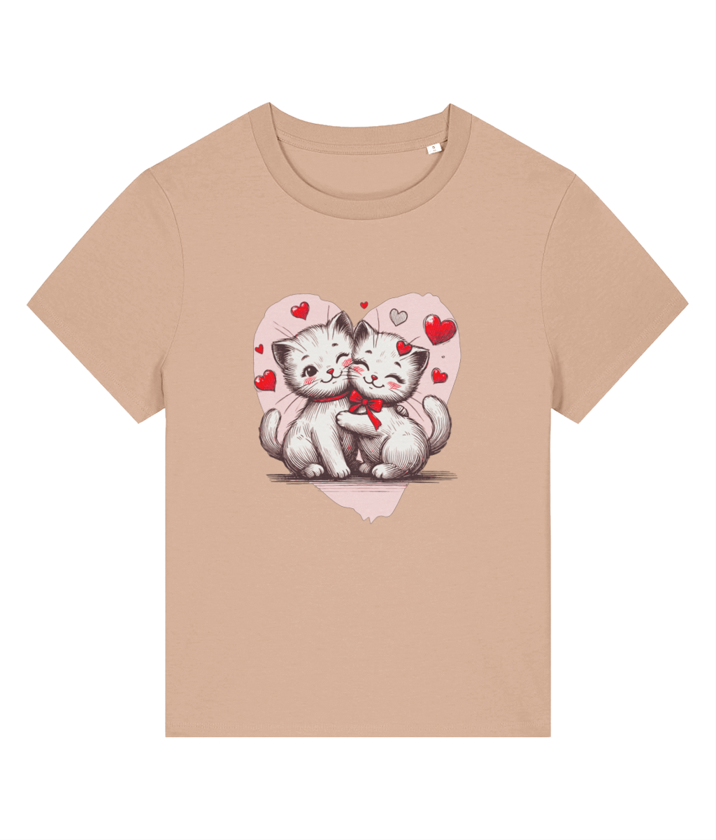 A womens beige short-sleeve crewneck t-shirt featuring a graphic print of two cute white kittens hugging inside a pink heart with red hearts.