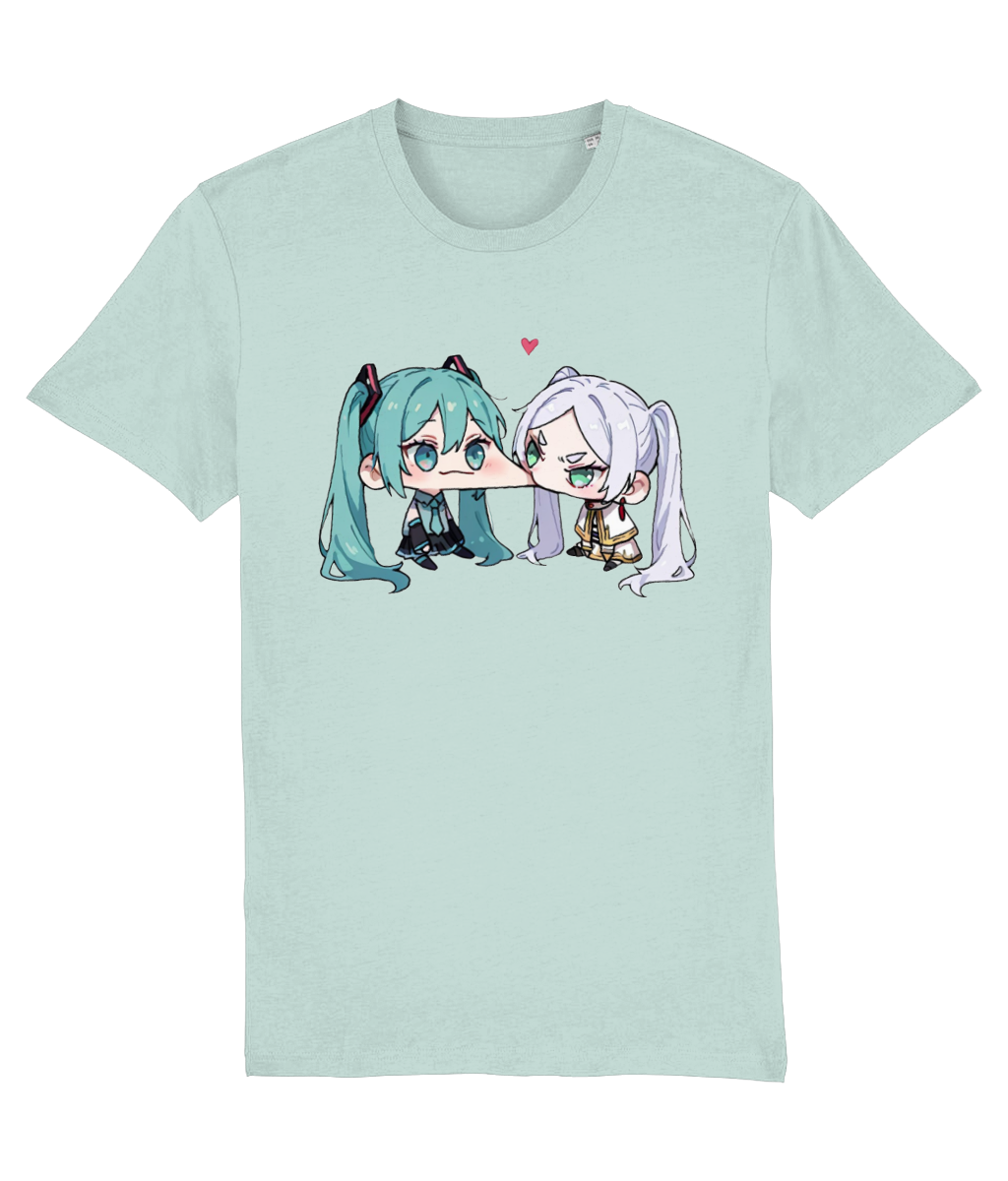 A womens Stanley/Stella light mint green short-sleeve crewneck t-shirt featuring a cartoon graphic of two chibi anime characters kissing, with a small pink heart above them.