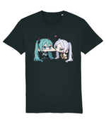 A dark charcoal gray short-sleeve t-shirt featuring a graphic print of two cute anime-style twin-tail characters kissing, with a small pink heart above them, shown against a plain white background.