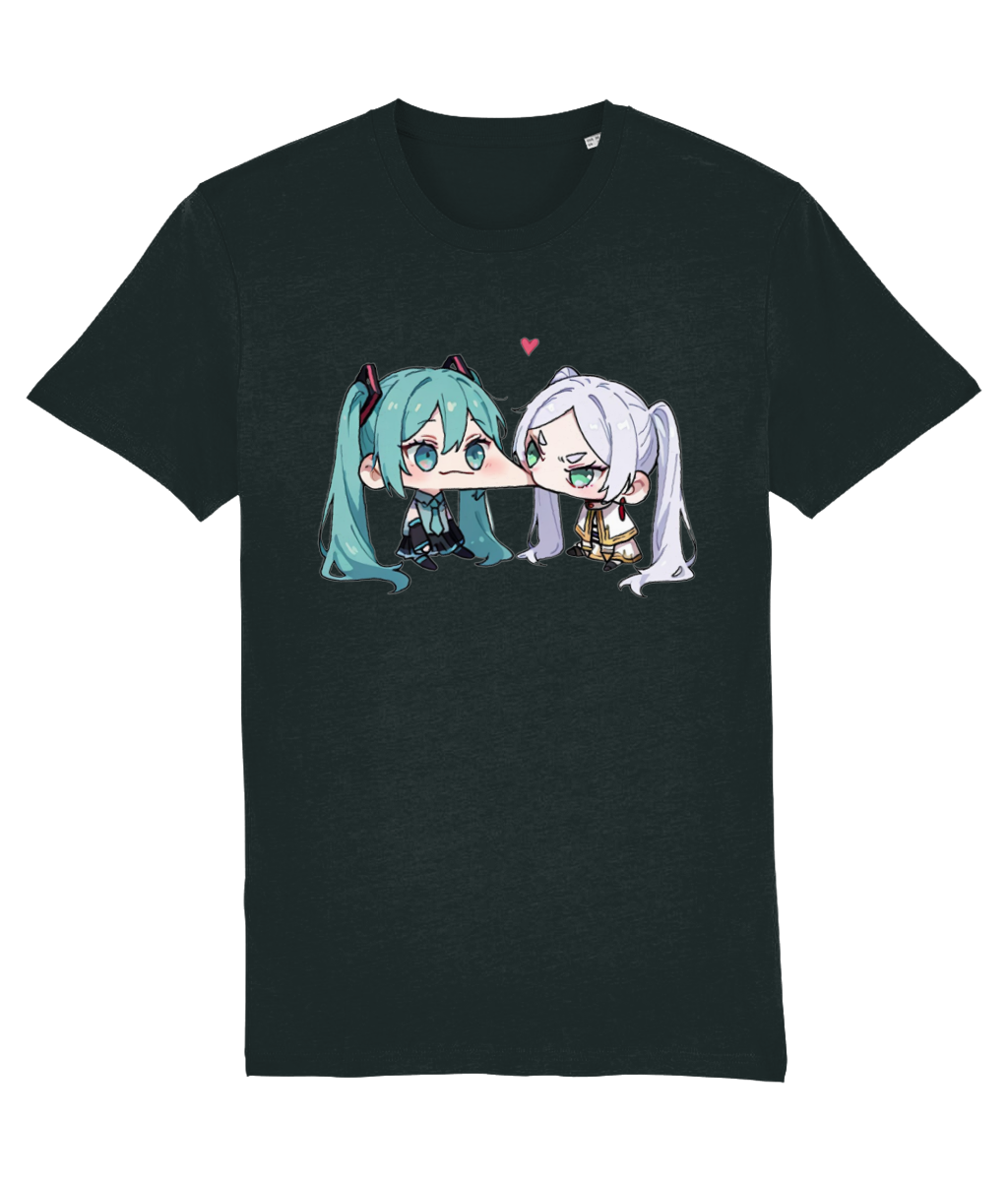 A dark charcoal gray short-sleeve t-shirt featuring a graphic print of two cute anime-style twin-tail characters kissing, with a small pink heart above them, shown against a plain white background.