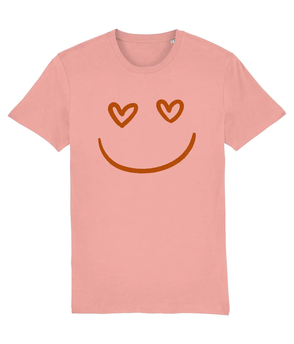 Women's Pink t-shirt with a smiley face design featuring heart eyes on a white background