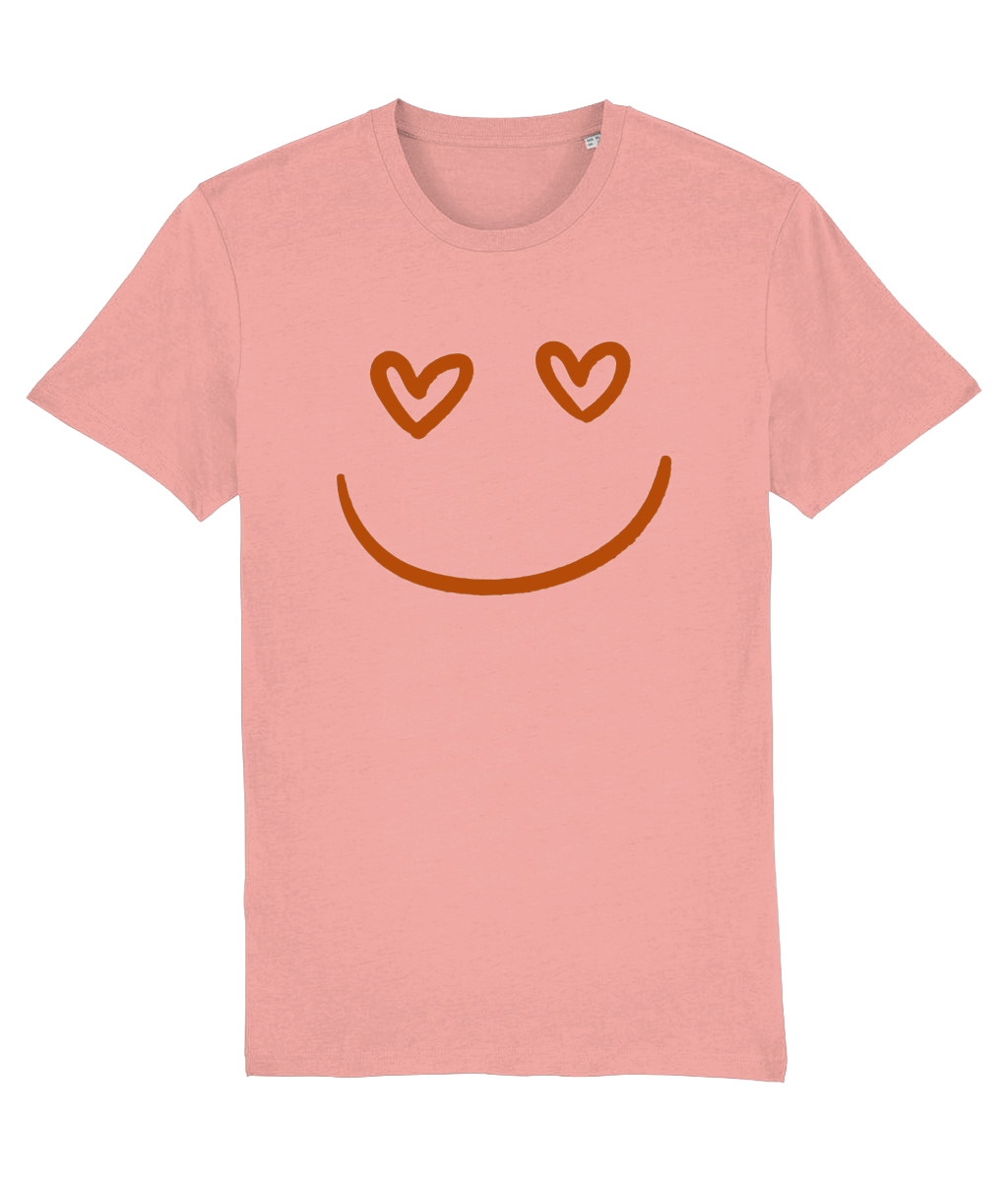 Women's Pink t-shirt with a smiley face design featuring heart eyes on a white background