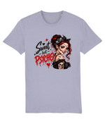 A light lavender-gray short-sleeve womens t-shirt with a graphic print on the front. The graphic features the text 'Sweet but Psycho' in black and red dripping lettering next to an illustration of a creepy woman with red hair, a black bandana, and a skull necklace.