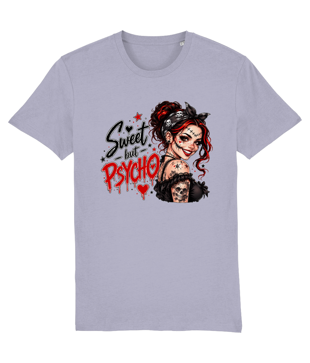 A light lavender-gray short-sleeve womens t-shirt with a graphic print on the front. The graphic features the text 'Sweet but Psycho' in black and red dripping lettering next to an illustration of a creepy woman with red hair, a black bandana, and a skull necklace.