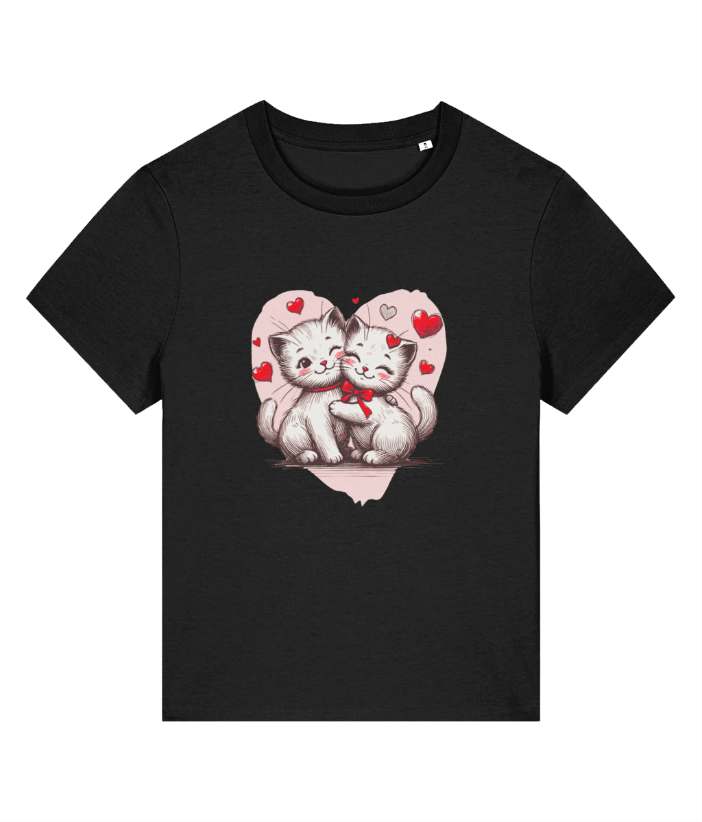 A womens Stanley/Stella Muser black short-sleeve crewneck t-shirt featuring a graphic print of two cute white kittens hugging inside a pink heart outline with small red hearts.
