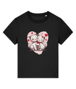 A womens Stanley/Stella Muser black short-sleeve crewneck t-shirt featuring a graphic print of two cute white kittens hugging inside a pink heart outline with small red hearts.