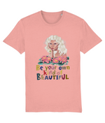 Women's Pink t-shirt with a graphic of a woman with flowers and the text 'Be your own kind of beautiful' on a white background.