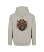 A light beige hoodie shown from the back, featuring a large graphic print of a skull riding a motorcycle with red and orange flames.