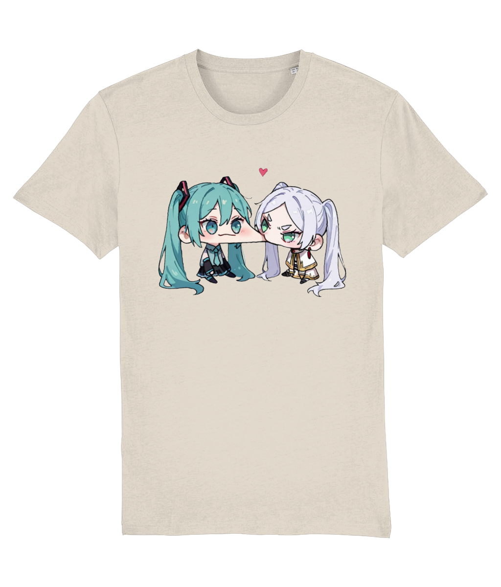 A womens Stanley/Stella light beige crewneck t-shirt featuring a graphic print of two chibi anime characters, one with teal hair and one with white hair, facing each other with a small pink heart above them.