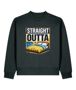 A dark charcoal gray crewneck sweatshirt featuring a graphic print on the front with the text 'STRAIGHT OUTTA' above an illustration of a bed with yellow and blue bedding.