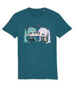 A womens teal short-sleeve crewneck t-shirt featuring a graphic print of two chibi anime characters with teal and white hair facing each other, with a small pink heart above them.