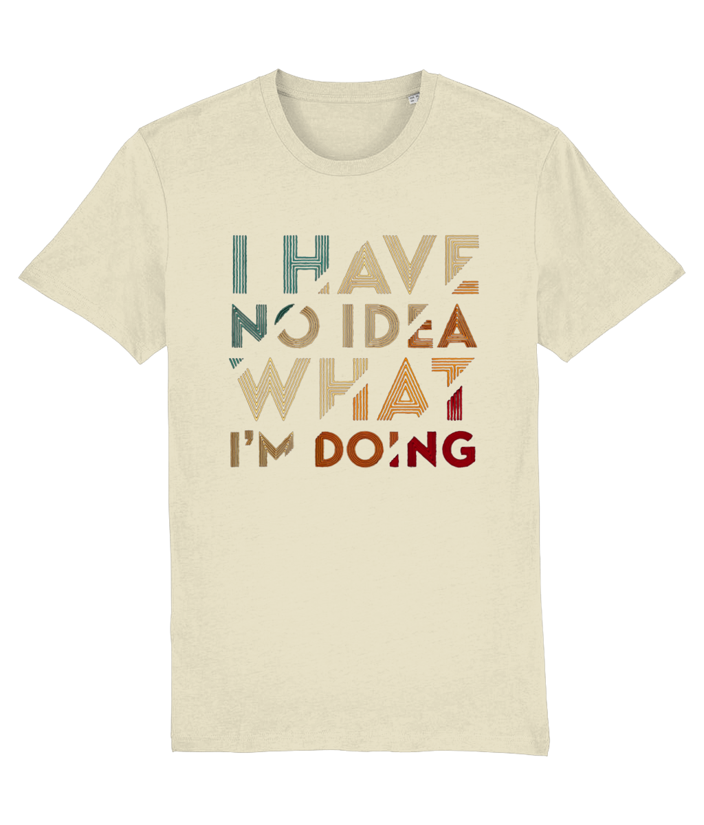 A cream-colored short-sleeve womens  t-shirt with a retro-style text graphic reading 'I HAVE NO IDEA WHAT I'M DOING' in muted teal, tan, brown, and red lettering, displayed against a solid white background.
