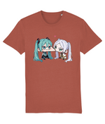 A womens short-sleeve crewneck t-shirt in a muted terracotta or rust color, featuring a graphic print of two chibi anime characters facing each other. The character on the left has teal hair, and the character on the right has white hair.