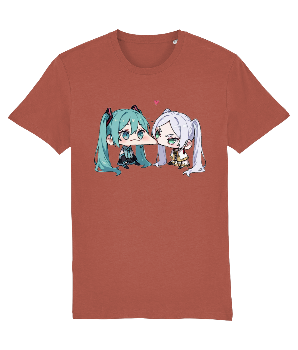 A womens short-sleeve crewneck t-shirt in a muted terracotta or rust color, featuring a graphic print of two chibi anime characters facing each other. The character on the left has teal hair, and the character on the right has white hair.
