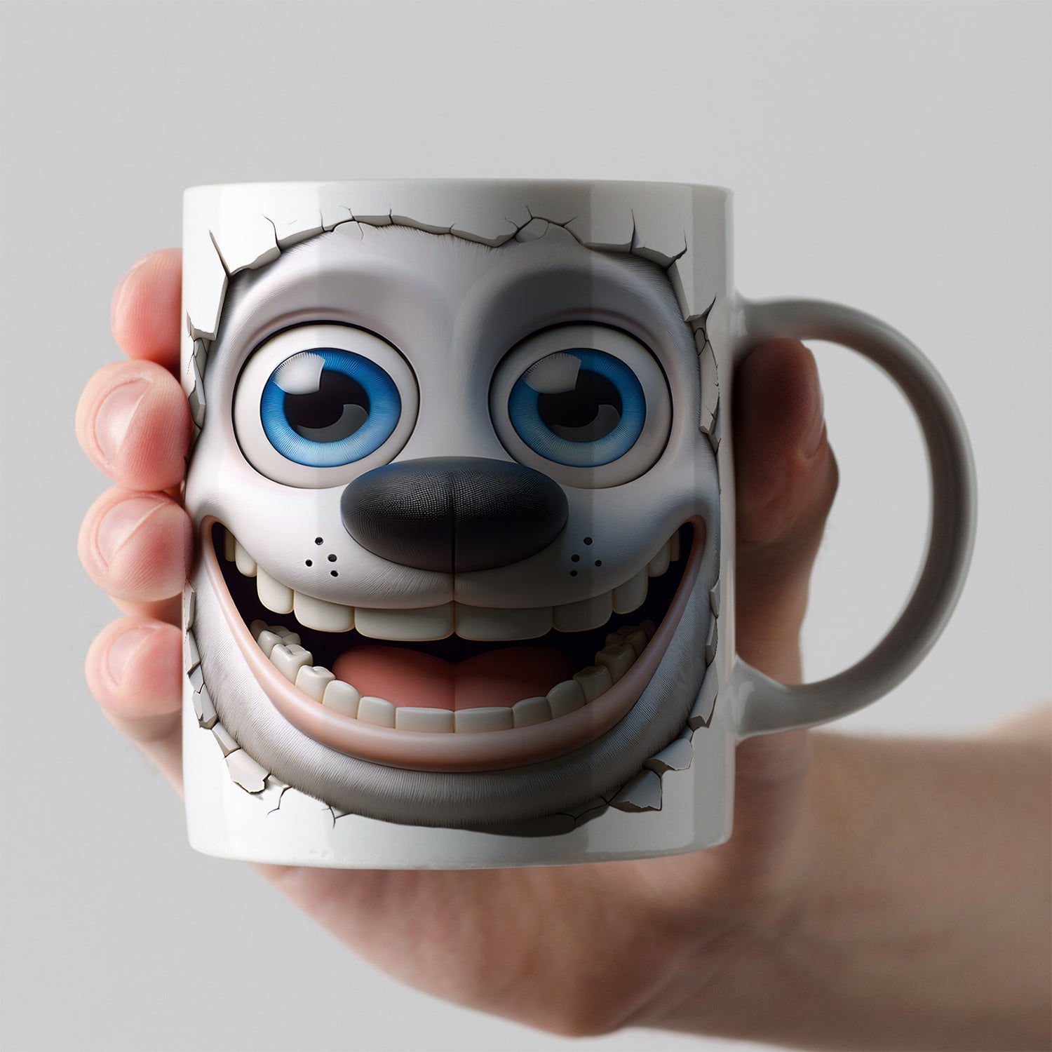 A hand holds a white mug featuring a cartoon dog face with large blue eyes, a big nose, and a wide, toothy grin, designed to appear as if breaking through the mug’s surface.
